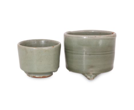 TWO SMALL LONGQUAN CELADON CENSERS
Ming dynasty, a smaller example circular censer narrowing to the foot, covered in pale-gre