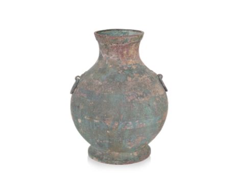 A BRONZE HU VESSEL Eastern Zhou-Han dynasty, ovoid body with wide belly tapering to a narrow waisted neck, taotie ring lugs t