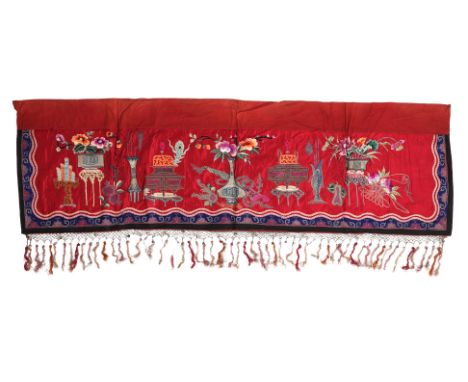 AN EMBROIDERED RED SILK ALTAR FRONT A rectangular panel of red silk ground decorated in embroidered goldwork precious objects
