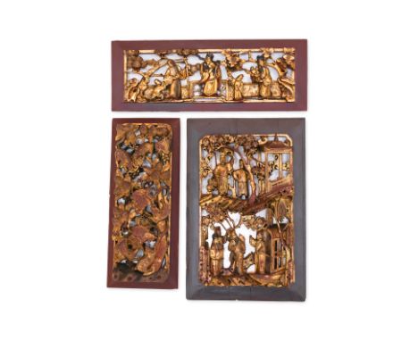 THREE CARVED GILTWOOD PANELS
Late 19th /early 20th Century, all well carved, one with Fu, Lu Shou with attendants on a terrac
