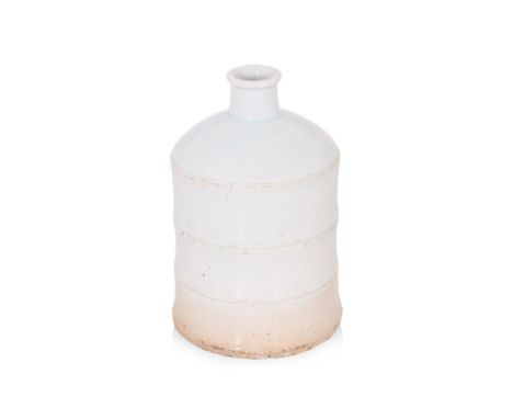 A KOREAN WHITE GLAZED RIBBED BOTTLE
Joseon Dynasty, 18th Century, the cylindrical bottle with down curved shoulder and ribbed