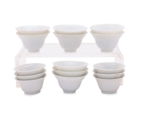 TWO SETS OF BLANC DE CHINE TEA BOWLS
A set of eight thinly potted white porcelain tea bowls standing on a narrow foot, and a 
