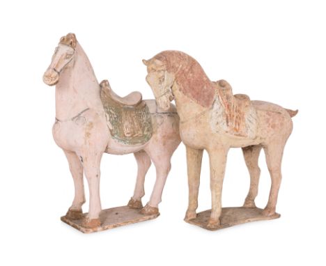 TWO PAINTED POTTERY MODELS OF HORSES
One example modelled with head tilted to the left side, the other facing forward, both u