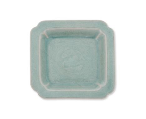 A KOREAN INCISED CELADON TWIN FISH SQUARE DISH
Believed Koryo dynasty, the square dish with incuse corners and recessed inter