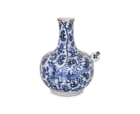 A BLUE AND WHITE PORCELAIN KENDI
Early Qing, painted with two phoenix amongst scrolling peonies, rim reduced, old collector's
