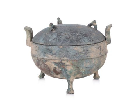 A BRONZE RITUAL FOOD VESSEL, DING Late Zhou dynasty, Warring States, compressed globular cauldron with three loop lugs to cov