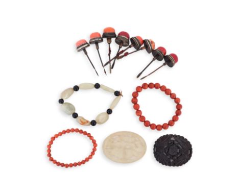 AN ASSORTED GROUP OF JADE AND CORAL ITEMS
Comprising: a group of eight coral snuff bottle tops, with metal mounts and spoons;