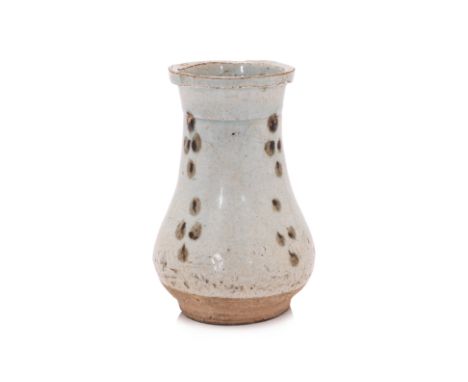 A SMALL IRON-SPOTTED QINGBAI VASE
Song-Yuan dynasty, bulbous body tapering to a wide mouth, pale blue-grey glaze decorated in