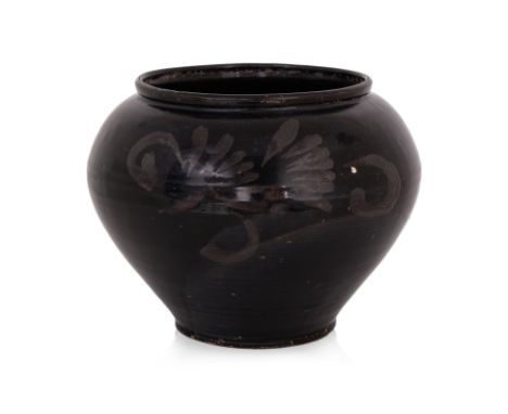 A LARGE BLACK GLAZED JAR
Jin-Song dynasty, compressed globular form with wide mouth rim tapering to the base, covered in brow