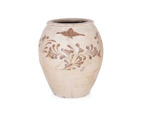 A LARGE CIZHOU WHITE-GLAZED AND PAINTED JAR
Oviform cream-white glazed stoneware jar decorated in freely painted brown foliat