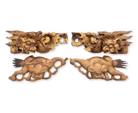 TWO PAIRS OF CARVED GILTWOOD MOUNTS
Late 19th-20th Century, comprising a pair of dragon examples and a pair of mythical beast