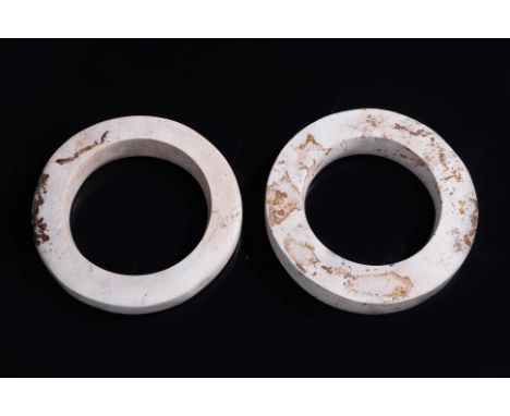 TWO NEOLITHIC LIANGZHU JADE DISCS OR BANGLES, HUAN (1) Calcified tremolite jade with highly polished flat surface, slightly c