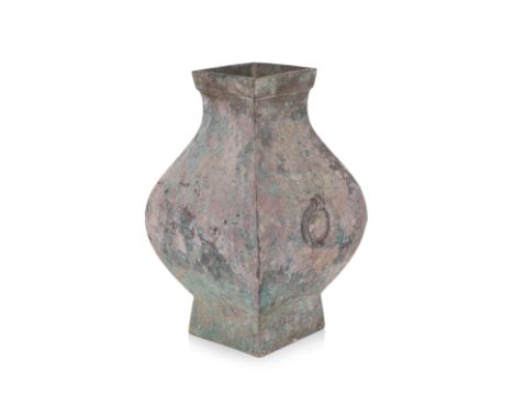 A BRONZE HU VASE Han dynasty, square form with curved sides, everted ridged neck, decorated with taotie mask and ring lugs 35