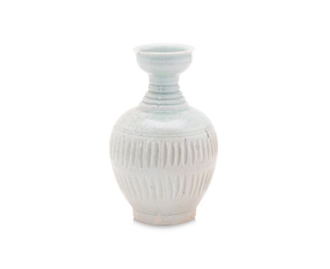 A QINGBAI PORCELAIN BOTTLE VASE
Song-Yuan dynasty, oviform body with ridged waisted neck and cup-like mouth, covered in trans