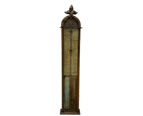 Admiral Fitzroy mercury barometer -  in a late 19th century fully glazed oak case c1870, with a round top and foliot carved a