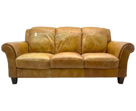 20th century traditional three seat sofa with rolled arms, upholstered in tan leather, on tapering feetDimensions: Height:&nb