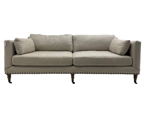 Grande three-seat sofa, traditional shape, upholstered in textured grey fabric, on turned supports with castorsDimensions: He