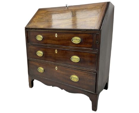 George III mahogany bureau, fall front enclosing fitted interior, three long cock-beaded drawers, on shaped apron with bracke