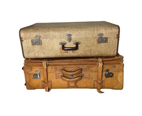 Two vintage suitcases, one a lightweight but large 50s/60s case and the other a later leather trunk case with wheels (2)