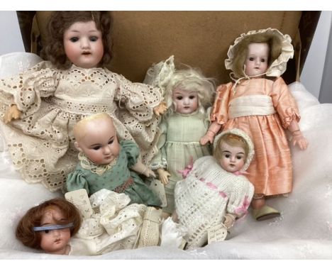 Antique small dolls selection 5 dolls and a spare head. Bisque head dolls t include 4 German dolls and a further head on a la