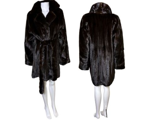 A Blackglama dark ranch mink belted jacket/ three quarter length coat, numbered label,  from John Kay of London. belt threads