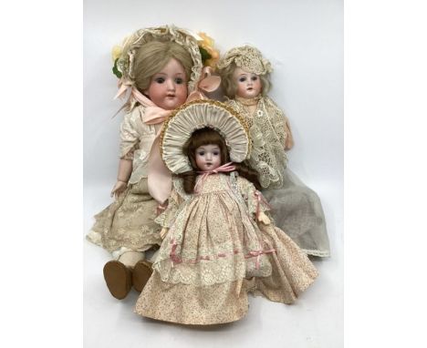 Antique dolls x 3 ; to include AM 390 Herm Steiner and a Heubach dolls bisque head attractive dolls with later clothes (3)