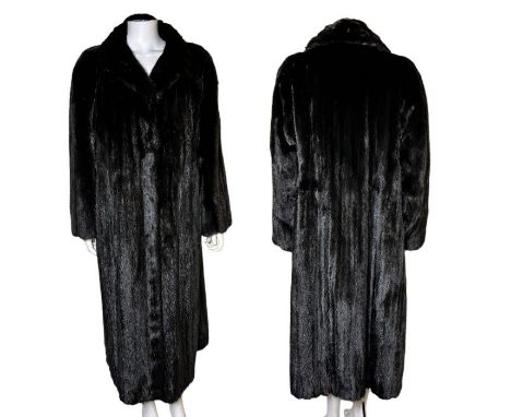 A fine quality full length mink coat in black with a black satin lining and internal swing ties with fur hook fastenings. 44 