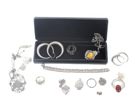 A collection of silver and white metal jewellery. To include three pairs of hoop earrings; five variously shaped lockets; a p