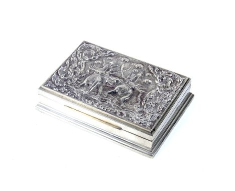 A vintage 'Siam silver' or white metal cigar box.  Embossed with warriors and elephants, 386g