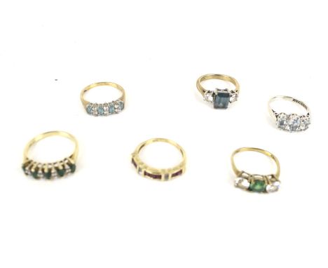 A group of six 9ct gold and gem set dress rings. Including; a square calibre-set ruby and tiny diamond half eternity ring, si