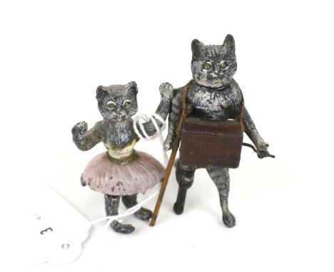 An Austrian cold painted and enamelled lead group of cats. One cat as a ballet dancer, the other with a peg-leg, playing an a
