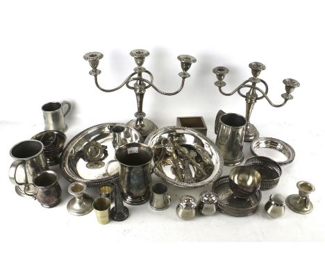 A collection of silver plate and pewter including two three-light/two-branch candelabra; a beaded oval entree dish, cover and
