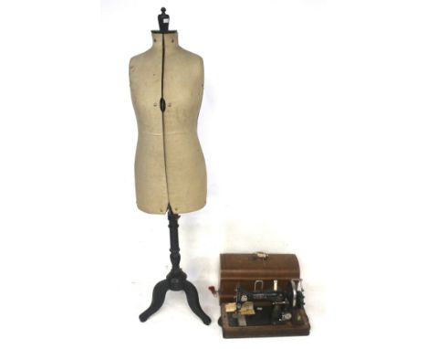 A vintage adjustable dressmaker's dummy and a Vesta sewing machine. The dummy mounted on a wooden tripod stand, H160cm, the s