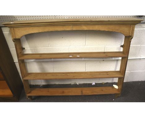 A 20th century pine wall mounted shelf unit. Containing three shelves, H110cm x W131cm x D22cm