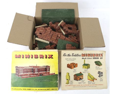 A collection of Minibrix bricks, roofs and base plates. In a variety of colours, with some vintage leaflets