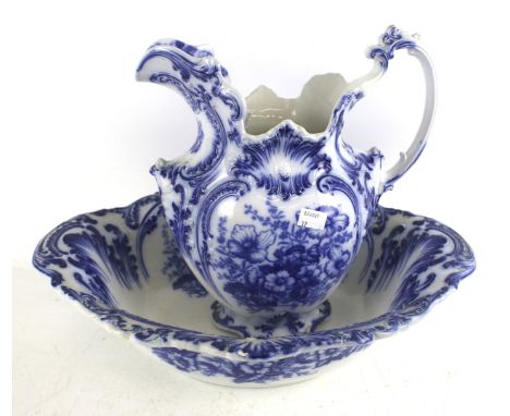 A Victorian blue and white pitcher and basin. Both decorated with printed flowers, H36cm