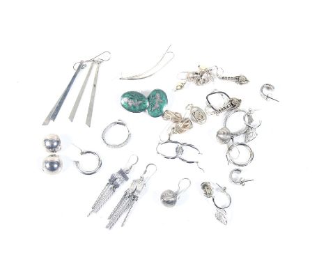 A collection of approximately 16 pairs of silver or white metal stud and pendent earrings. In many various designs including 