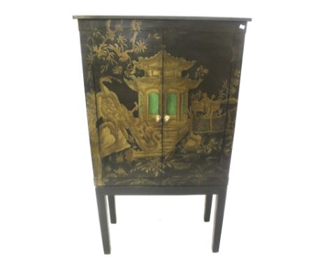 A contemporary Chinese style TV cabinet on stand. The exterior painted with a scene of birds and a pagoda on a black ground, 