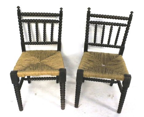 A pair of bobbin turned and rush seat chairs. H83cm