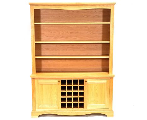 Modern oak dresser, moulded cornice, three shelf panelled back, the base with wine rack and two cupboards, bracket feet, widt