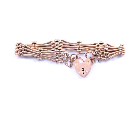 A rose metal 10.8mm wide four bar gate link bracelet, padlock fastener and safety chain, marked 9ct, 11.6g.