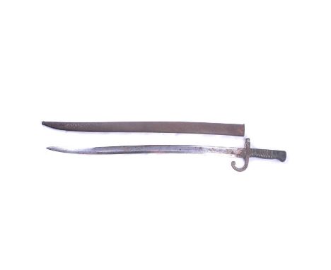 A French bayonet with scabbard, late 19th century, brass handle, heavy corrosion to the hilt and scabbard, overall length 71.