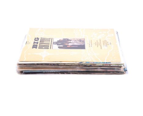 Over one-hundred vinyl LP records, including Electric Light Orchestra, U2, Jon Vangelis, Santana, and others