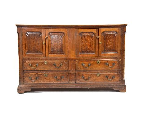 Oak mule chest, adapted, with hinged front doors above drawers, bracket feet, width 148cm, depth 55cm, height 93cm.Qty: 1Cond