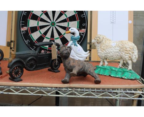 FOUR VARIOUS VINTAGE CAST IRON DOOR STOPS TO INCLUDE A SCOTTY DOG AND A SHEEP ETC 
