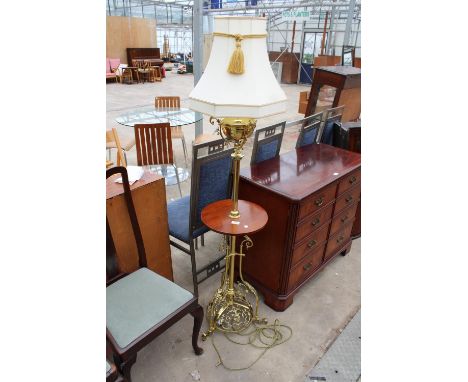 A VICTORIAN OIL STANDARD LAMP ON ORNATE BRASS FRETWORK BASE, BRASS COLUMN AND MAHOGANY SHELF, WITH SHADE 