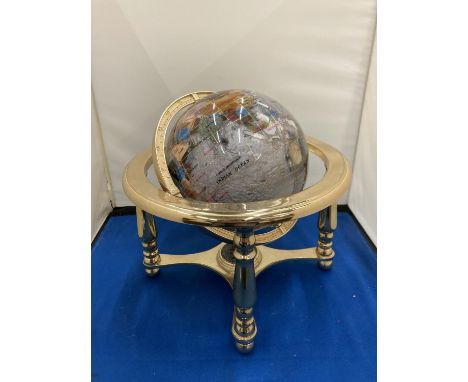 A SEMI PRECIOUS STONE GLOBE ON A BRASS STAND WITH COMPASS 