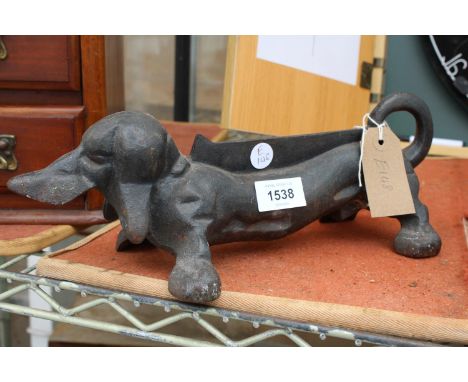 A VINTAGE CAST IRON SAUSAGE DOG DOOR STOP 