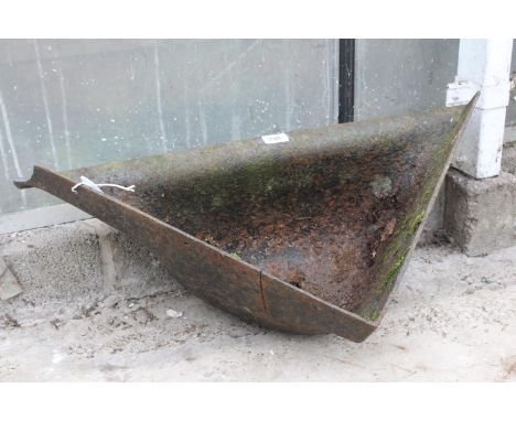 A VINTAGE CAST IRON CORNER PIG TROUGH 