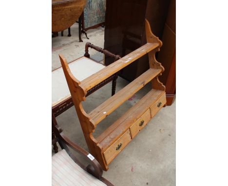A VICTORIAN STYLE PINE THREE TIER WALL SHELF ENCLOSING THREE DRAWERS, 36" WIDE 